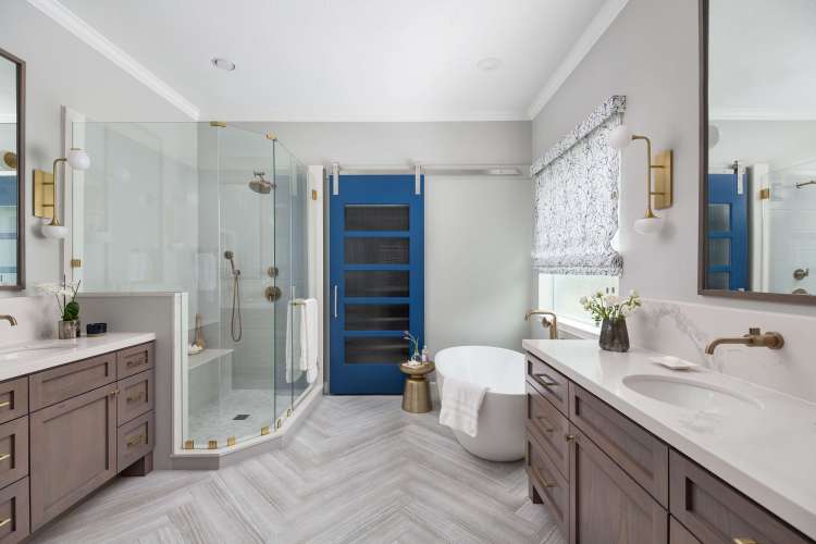 Spacious master bathroom featuring a freestanding tub and double vanity